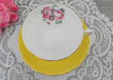 Vintage Yellow Teacup and Saucer with Pink Roses and Daisies