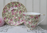 Chintz Pink and White Cottage Roses on Yellow Teacup and Saucer